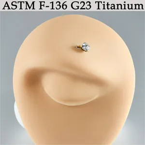Close-up of G23 titanium dermal anchor with clear round sparkling zircon