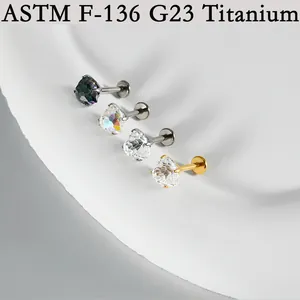 Close-up of G23 titanium labret studs with sparkling heart-shaped zirconia stones