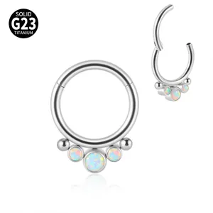 G23 titanium septum ring featuring three synthetic opals and decorative metal beads.