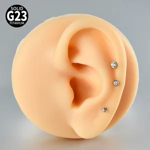 Macro view of G23 titanium internally threaded labrets with round cubic zirconia studs