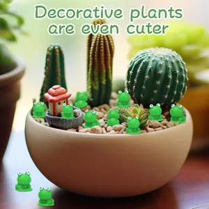 Detailed view of cute mini resin frog figurines decorating a succulent cactus pot