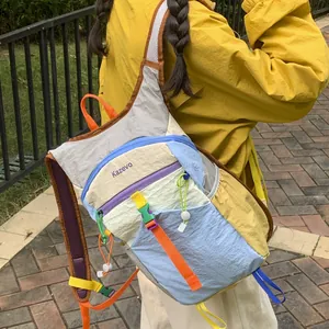 Detailed view of a colorful dopamine outdoor hiking backpack for women worn by a model