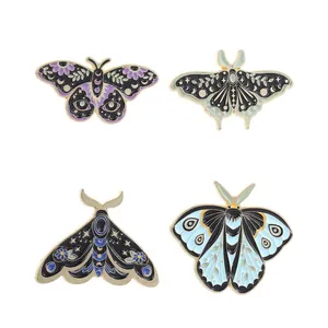 Vintage enamel moth and butterfly lapel pin set with celestial star and moon patterns.