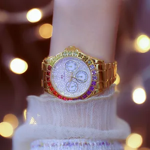 Close-up of BS women's gold watch with rainbow crystal bezel and elegant glitter dial