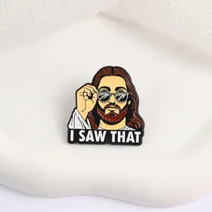 Detailed view of funny bearded character enamel pin with 'I SAW THAT' text on white stone