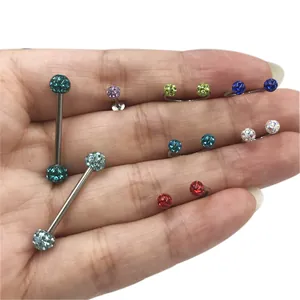 Close-up detail of 16G G23 titanium piercing jewelry set with colorful glitter balls