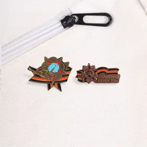 Detail of vintage Soviet-themed metal badges with St. George's ribbon design