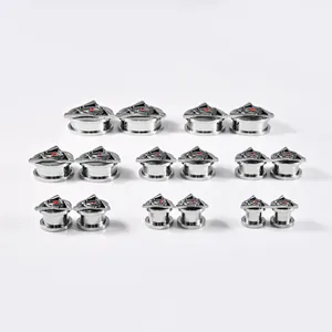 Premium stainless steel ear gauges featuring a triangle evil eye engraving and red stone inlay