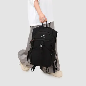 Large capacity black outdoor hiking backpack shown being carried by a walking model
