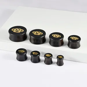 Handcrafted black ebony wood ear gauges with gold knuckle duster pattern in eight sizes