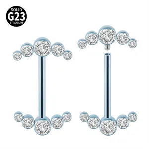 Detail of G23 titanium nipple ring with internal thread and blue crystal cluster