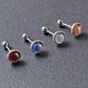 Detailed view of iridescent mini ear studs in various colors with stainless steel bars.