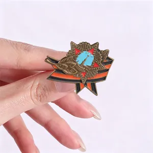 Macro view of vintage Soviet star badge with black and orange ribbon on white background
