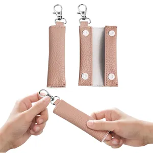 Detailed view of dusty rose lychee pattern leather pouch with snap closure and clip