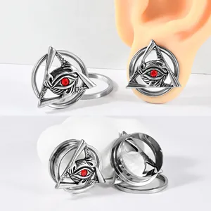 Stainless steel evil eye triangle ear gauges featuring a red rhinestone and gothic design