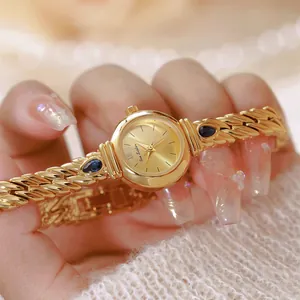 Reloj de lujo vintage dorado para mujer con circonitas azules y correa de cadena