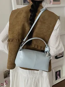 Fashionable light blue retro pillow bag for women with top handle and crossbody strap
