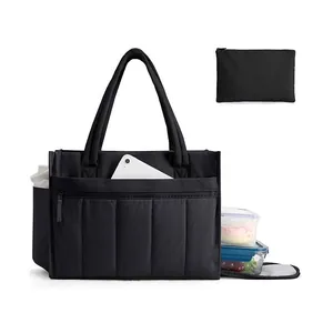 Large black quilted tote bag with laptop compartment, lunch boxes and water bottle pocket