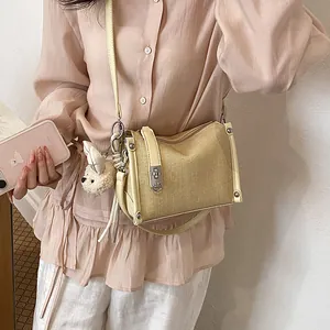 Casual summer pillow bag with textured fabric and cute plush bear charm decoration