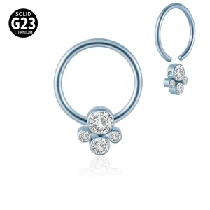 Detail view of G23 titanium BCR nose ring featuring a four-stone clear CZ cluster design