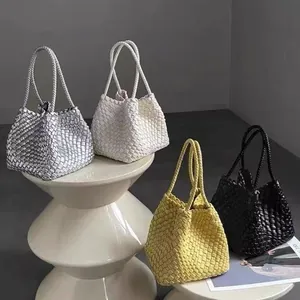 Hand-woven bucket bags displayed in silver, white, yellow, and black fashion colors.