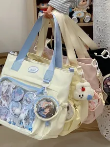 Stylish canvas ita bag for women featuring a clear display window for anime badges.