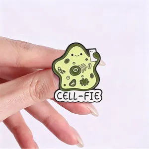 Fun biology 'Cell-fie' enamel pin showing a cartoon cell taking a selfie