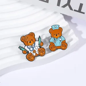Detailed view of cartoon teddy bear enamel pins dressed as doctor and nurse professionals