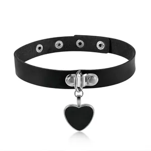 Close-up detail of a black leather punk choker featuring a silver heart-shaped pendant.