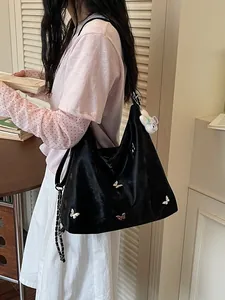 Stylish black large capacity commuter bag with elegant butterfly accents for women
