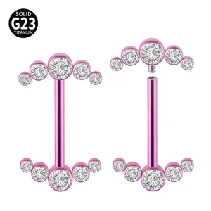 Close-up of pink G23 titanium nipple rings with internal threading and rhinestones