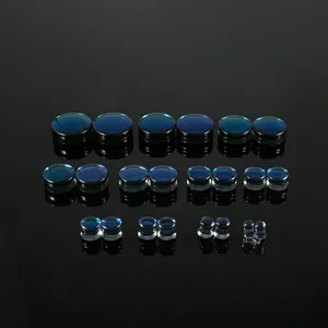Premium dark blue gradient glass ear plugs and tunnels set on black reflective surface