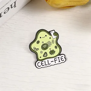 Detailed close-up of a cartoon cell enamel pin with 'CELL-FIE' biology pun design