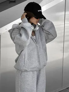 Oversized grey hooded zip-up sweatshirt and matching sweatpants set for women