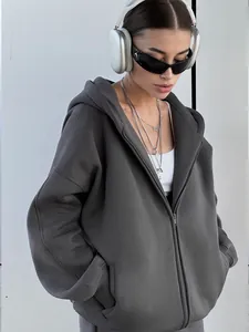 Detailed view of women's oversized charcoal grey zip-up hoodie with hood