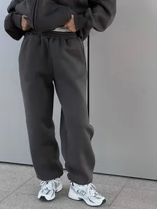 Detailed macro view of dark grey zip-up hoodie and matching joggers two-piece lounge set