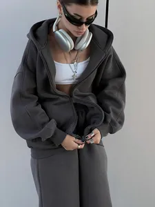 Macro view of textured fabric and oversized fit of this grey hoodie and sweatpants set.