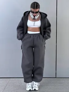 Women's casual two-piece tracksuit set featuring a grey zip-up hoodie and matching joggers