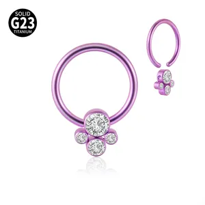Detailed view of G23 titanium BCR nose ring with sparkling CZ cluster in purple finish