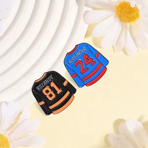 Detailed view of high-quality enamel hockey jersey pins featuring Hollander and Rozanov