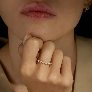 Elegant S925 sterling silver ring featuring teardrop cubic zirconia on model's hand.