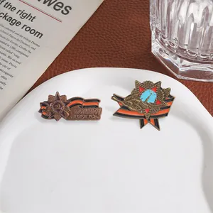 Detailed macro view of vintage Soviet-style metal commemorative badges with enamel finish.