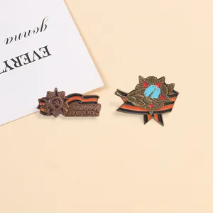 Macro view of vintage Soviet-style metal badges featuring St. George ribbon patterns