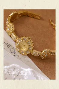 Detailed view of elegant gold Bee Sister flower bracelet watch with rhinestone accents