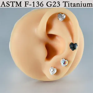 Detail view of multicolored heart zircon piercing jewelry on silicone ear, G23 titanium material