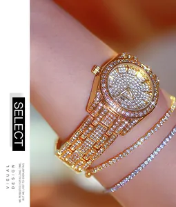 Luxury women's full diamond gold watch and sparkling rhinestone bracelets shown on wrist