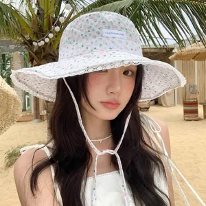 Women's floral lace bucket hat with a wide brim providing summer sun protection outdoors