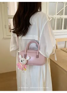 Sac bowling en cuir rose pour femme avec pendentif lapin crochet, sac bandoulière rétro.