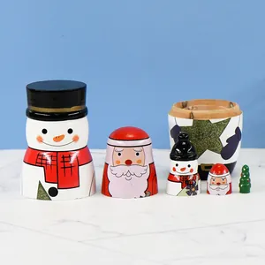 Hand-painted wooden Christmas nesting dolls set with snowman and Santa Claus characters