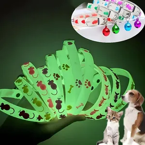 Fluorescent silicone pet collar with glowing bells and cute animal paw patterns.